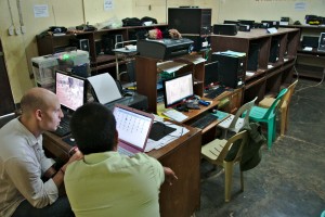 Daniel with the ANHS's Computer Teacher fixing the computer issues